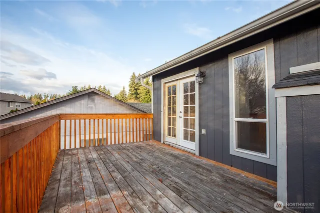 a view of outdoor space with deck and flat screen tv