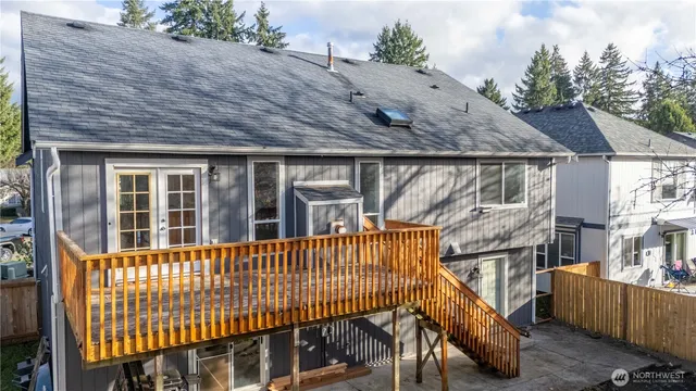 a view of a house with wooden fence