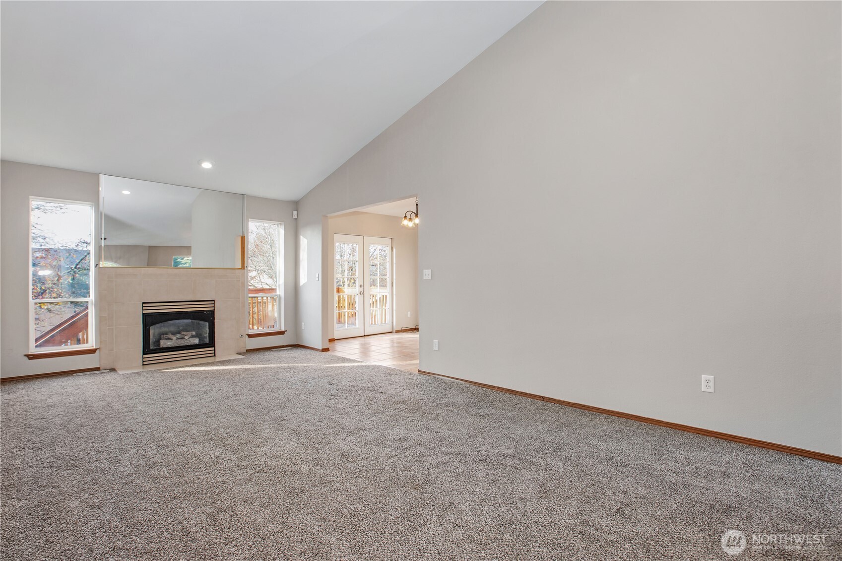 5607 Vincent Court Southeast Lacey, WA 98513 - Photo 4 of 40 a view of an empty room with a fireplace and a window