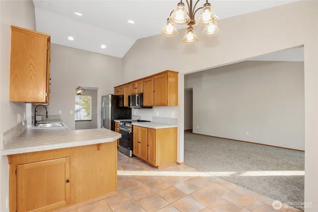a kitchen with a sink and a refrigerator