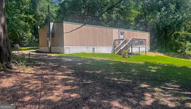 a backyard of a house with lots of green space