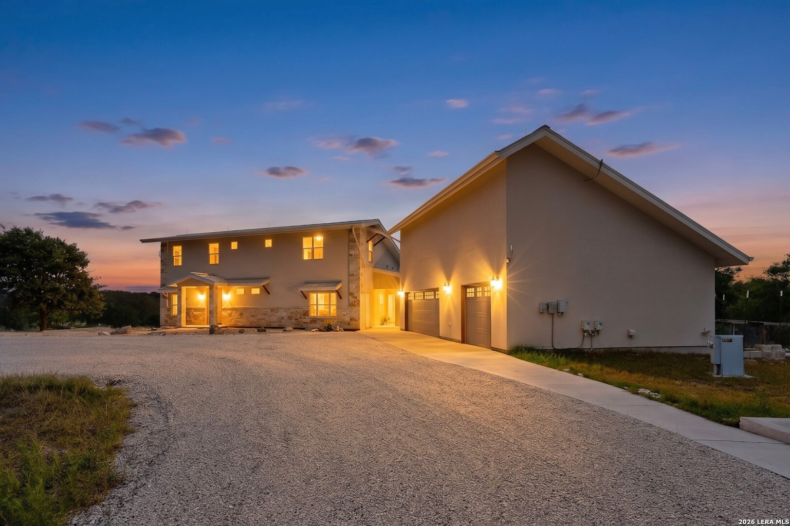 3263 Palomino Springs Bandera, TX 78003 - Photo 1 of 8 a view of a house with a yard and garage