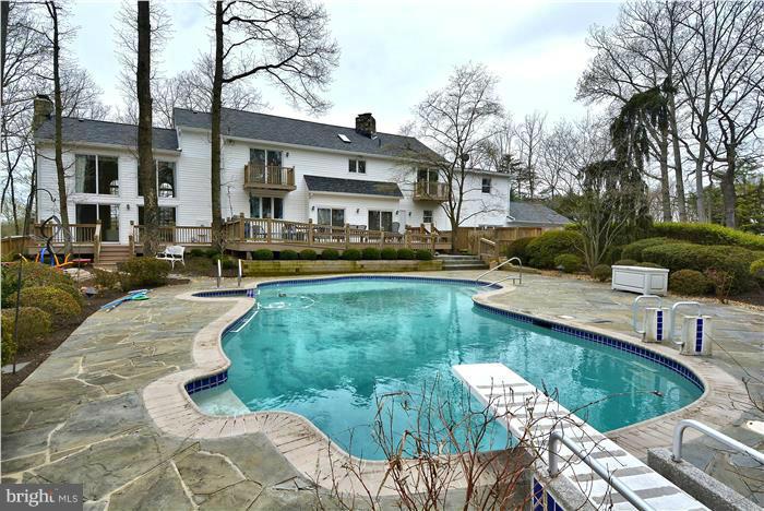 1291 Berry Place McLean, VA 22102 - Photo 2 of 30 a view of a house with swimming pool and sitting area
