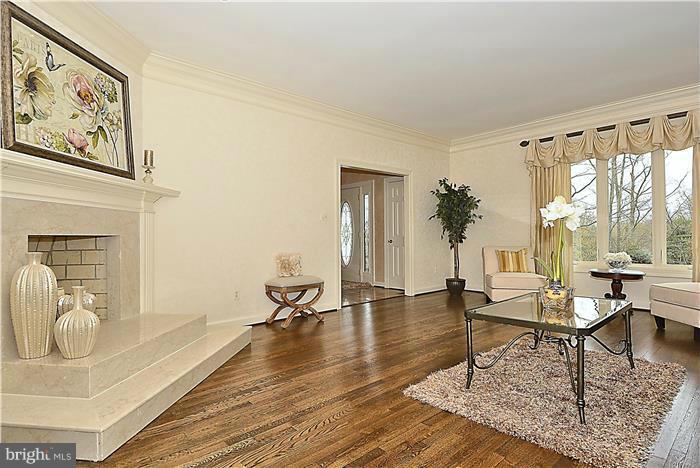 1291 Berry Place McLean, VA 22102 - Photo 12 of 30 a living room with furniture a table and large windows