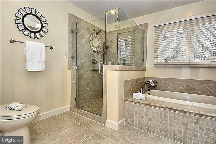 1291 Berry Place McLean, VA 22102 - Photo 15 of 30 a bathroom with a toilet sink and shower