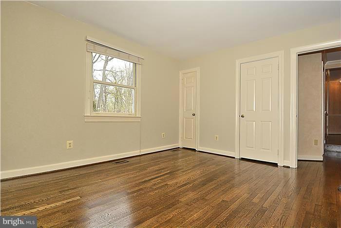 1291 Berry Place McLean, VA 22102 - Photo 18 of 30 an empty room with wooden floor and windows