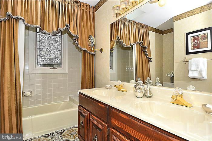 1291 Berry Place McLean, VA 22102 - Photo 20 of 30 a bathroom with a sink a bathtub and a shower