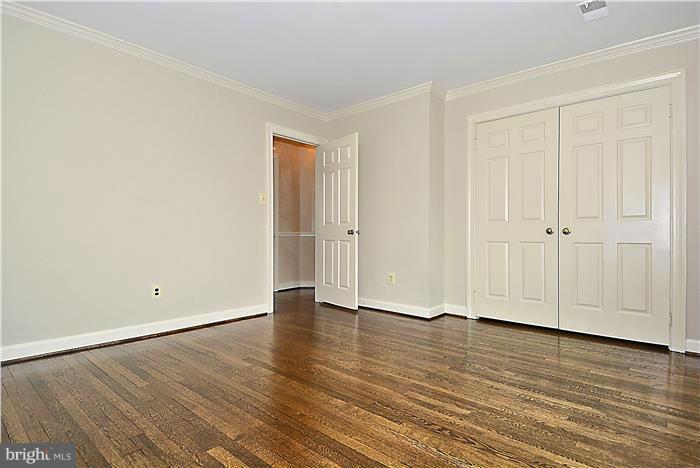 1291 Berry Place McLean, VA 22102 - Photo 24 of 30 a view of an empty room with wooden floor