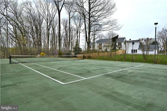 1291 Berry Place McLean, VA 22102 - Photo 29 of 30 a view of a tennis ground with large trees