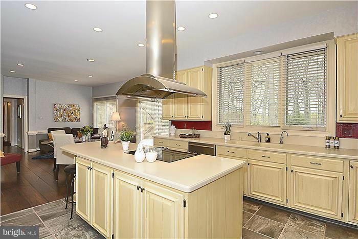 1291 Berry Place McLean, VA 22102 - Photo 4 of 30 a kitchen with a sink stove and cabinets