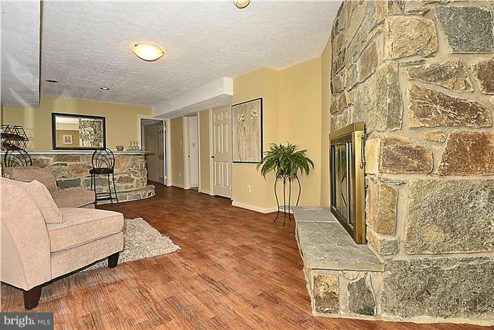 1291 Berry Place McLean, VA 22102 - Photo 6 of 30 a living room with furniture and a fireplace