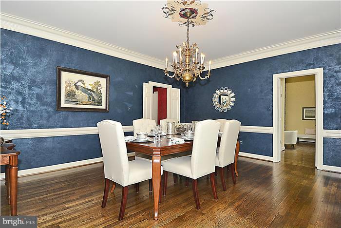 1291 Berry Place McLean, VA 22102 - Photo 9 of 30 a view of a dining room with furniture wooden floor and chandelier