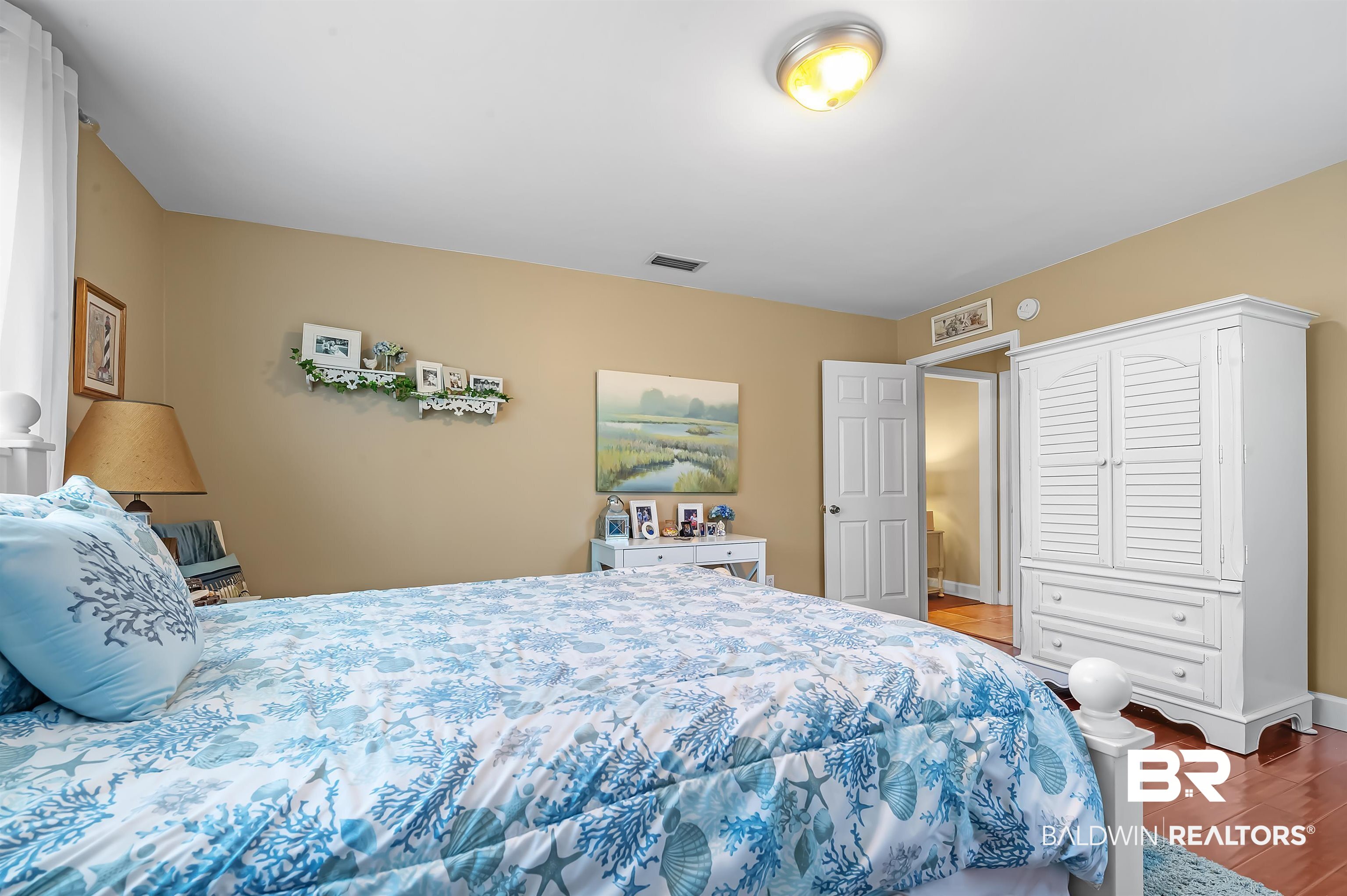 9901 Glover Court Fairhope, AL 36532 - Photo 25 of 52 Bedroom featuring hardwood / wood-style flooring