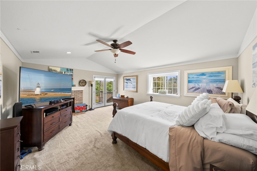 3162 Reche Road Fallbrook, CA 92028 - Photo 18 of 33 a large bedroom with a large bed a flat tv screen and dresser