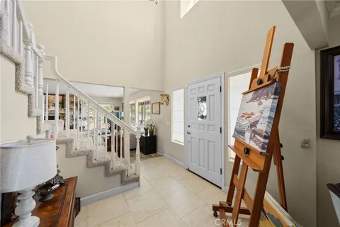 a living room with furniture large window and a fireplace