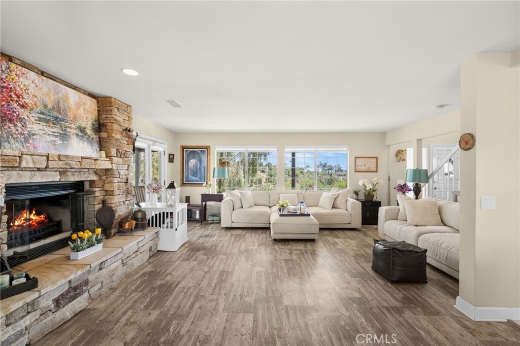 3162 Reche Road Fallbrook, CA 92028 - Photo 4 of 33 a living room with furniture large window and a fireplace