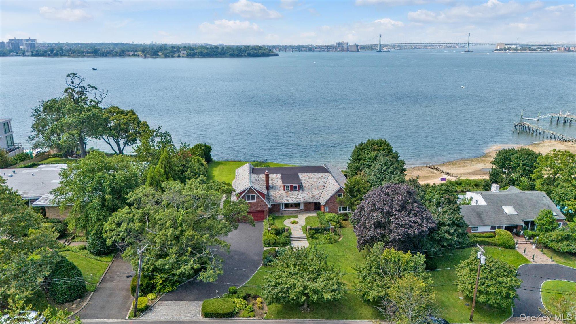 an aerial view of a house with a lake view