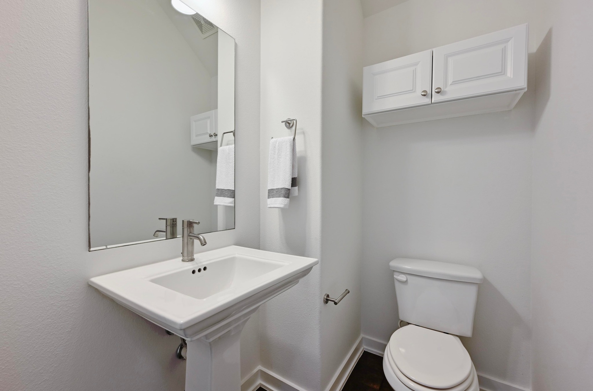 8901 Parker Ranch Circle, Unit A Austin, TX 78748 - Photo 15 of 31 Clean lines and classic architectural detailing define this functional powder room space.
