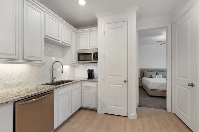 a bathroom with a sink toilet and vanity