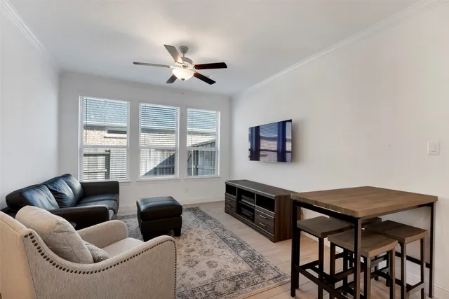 a kitchen with stainless steel appliances granite countertop a sink and dishwasher with white cabinets