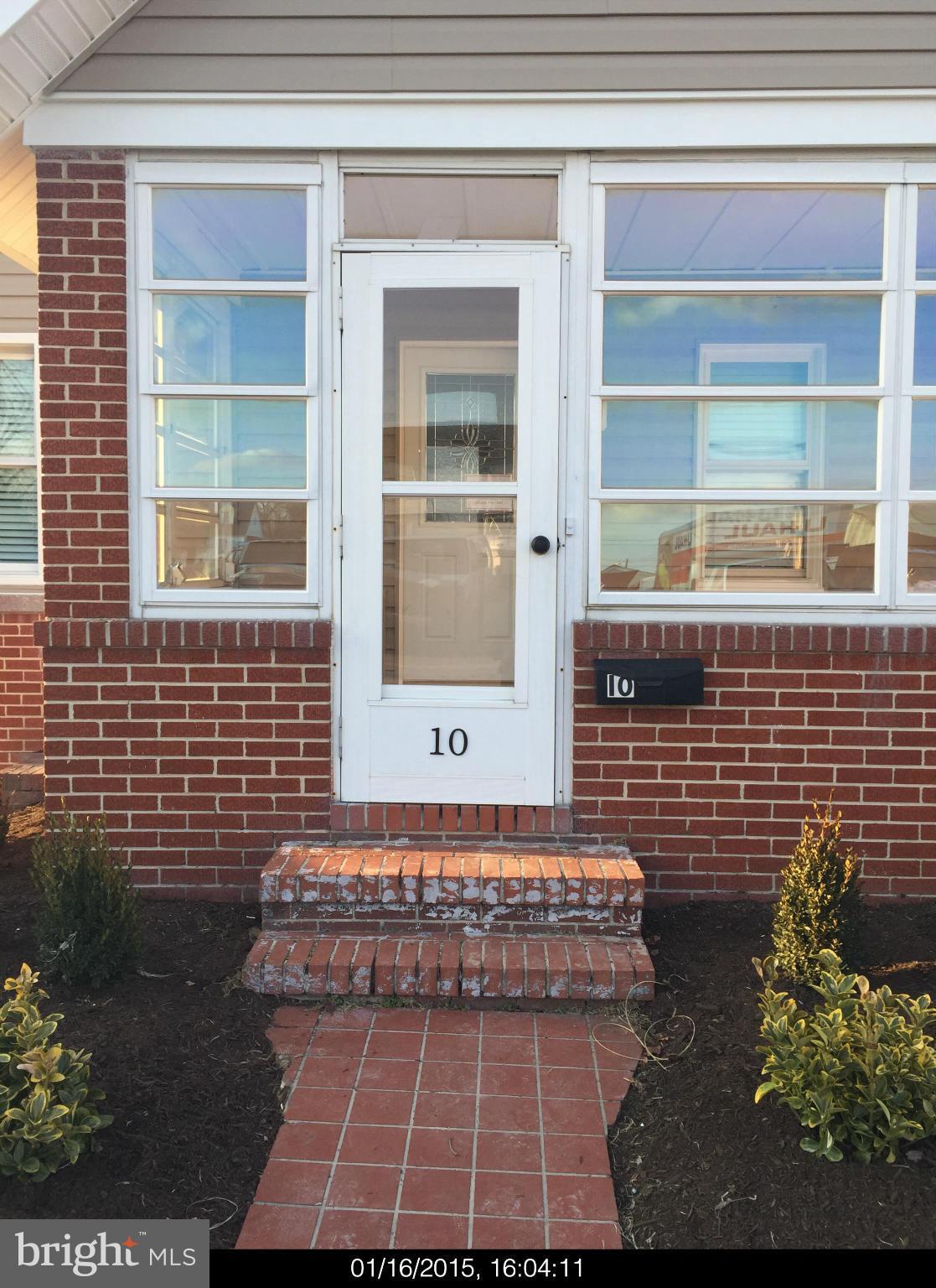 10 Manchester Road Pasadena, MD 21122 - Photo 4 of 28 Brick Front Entrance to Enclosed Porch