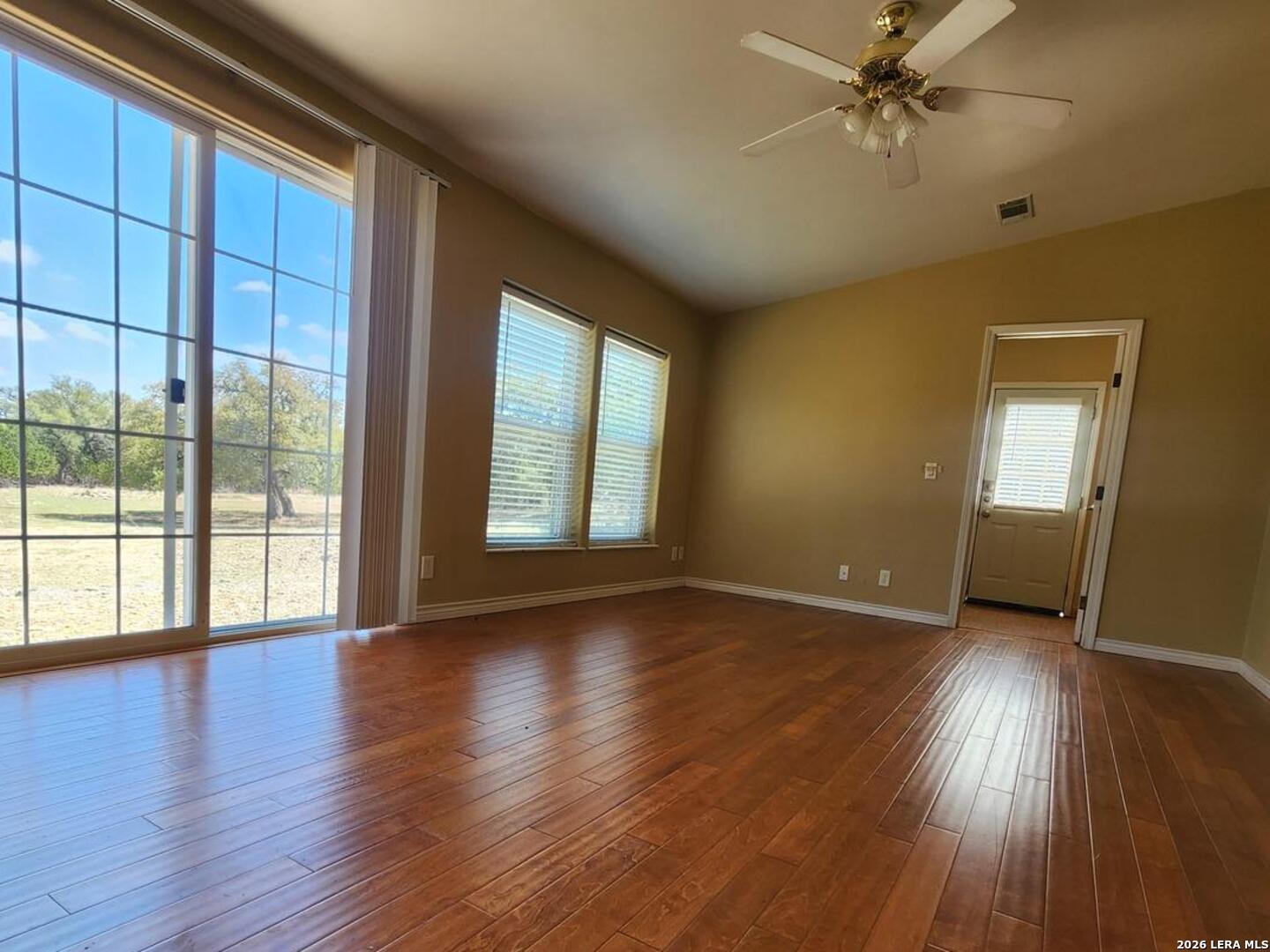 140 River Ranch Road Boerne, TX 78006 - Photo 20 of 30 a view of an empty room with wooden floor and a window