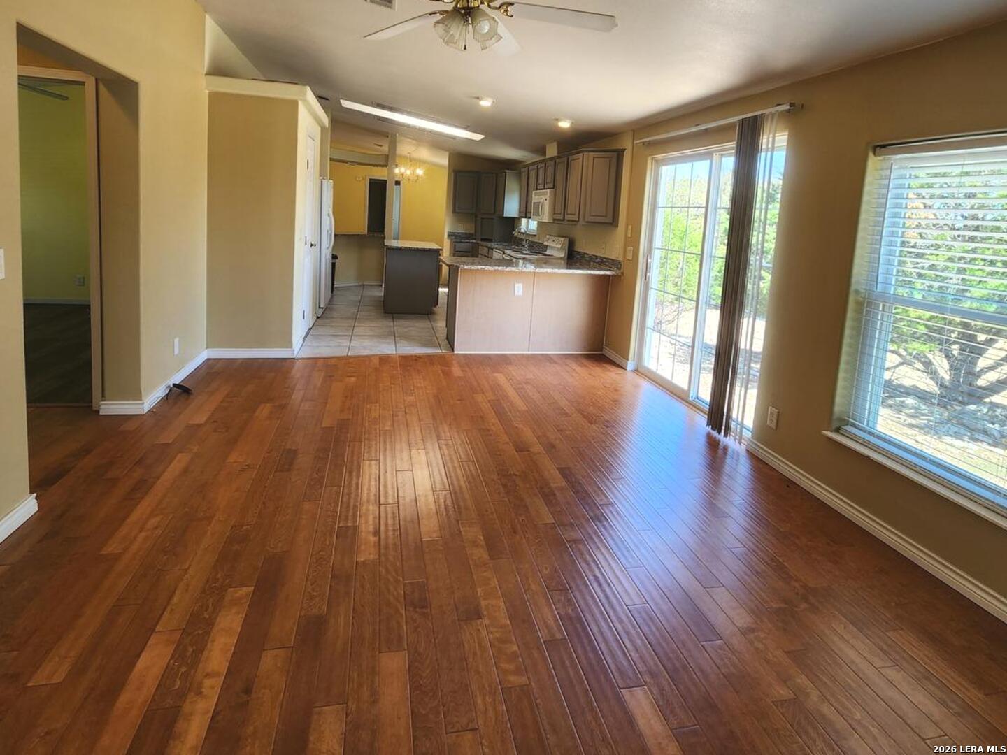 140 River Ranch Road Boerne, TX 78006 - Photo 21 of 30 a view of a kitchen with wooden floor and stainless steel appliances
