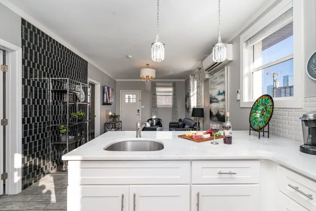 a kitchen with a sink and a refrigerator