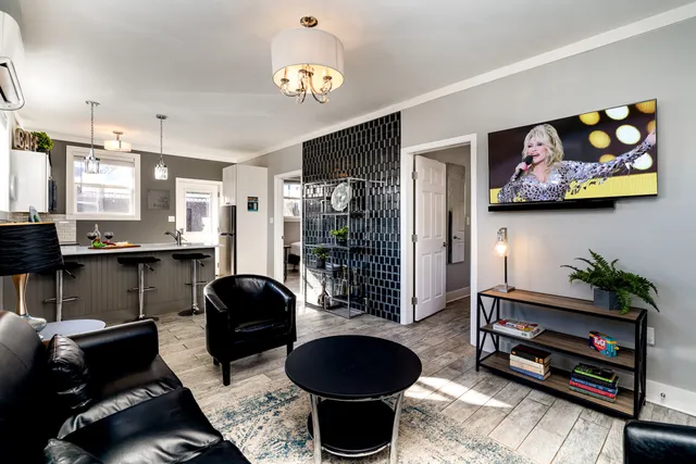 a living room with furniture and a flat screen tv