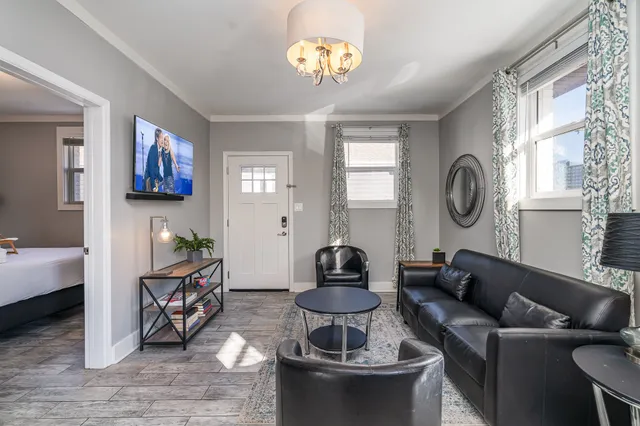 a living room with furniture and a window
