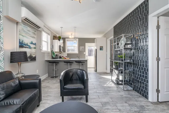 a living room with furniture and a window
