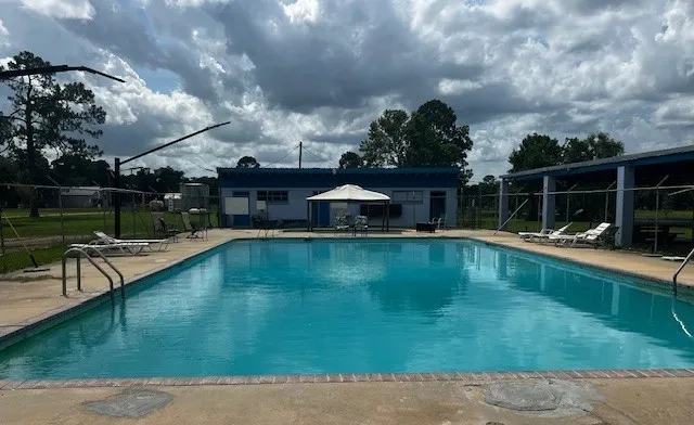 a view of swimming pool with seating space