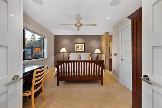 a living room with furniture a fireplace and a table
