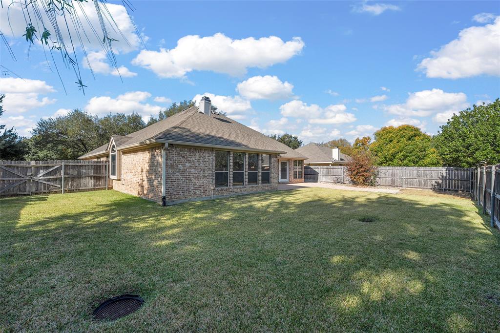 302 Canterbury Road Waco, TX 76712 - Photo 25 of 29 a view of a house with a backyard