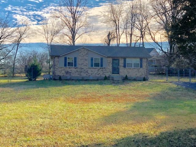 7820 Chester Road Fairview, TN 37062 - Photo 1 of 22 a front view of a house with a yard and swimming pool