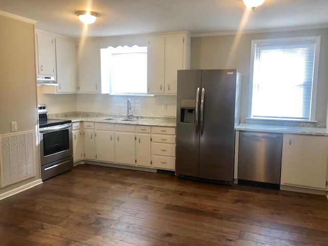 7820 Chester Road Fairview, TN 37062 - Photo 12 of 22 a kitchen with stainless steel appliances granite countertop a refrigerator sink and microwave
