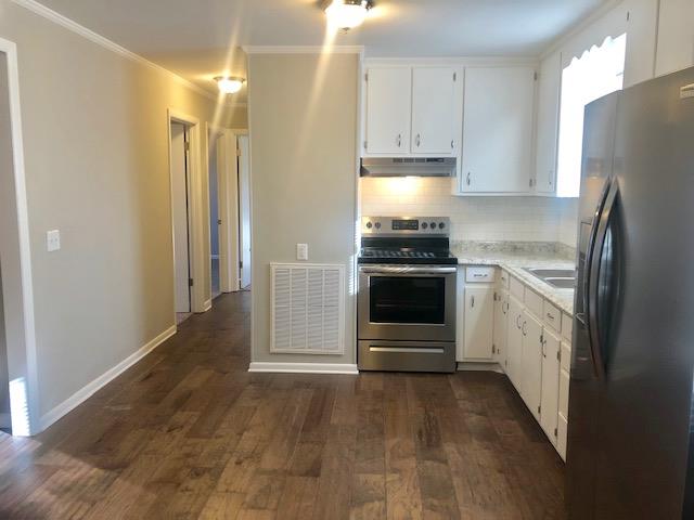 7820 Chester Road Fairview, TN 37062 - Photo 15 of 22 a kitchen with stainless steel appliances granite countertop a refrigerator and a stove