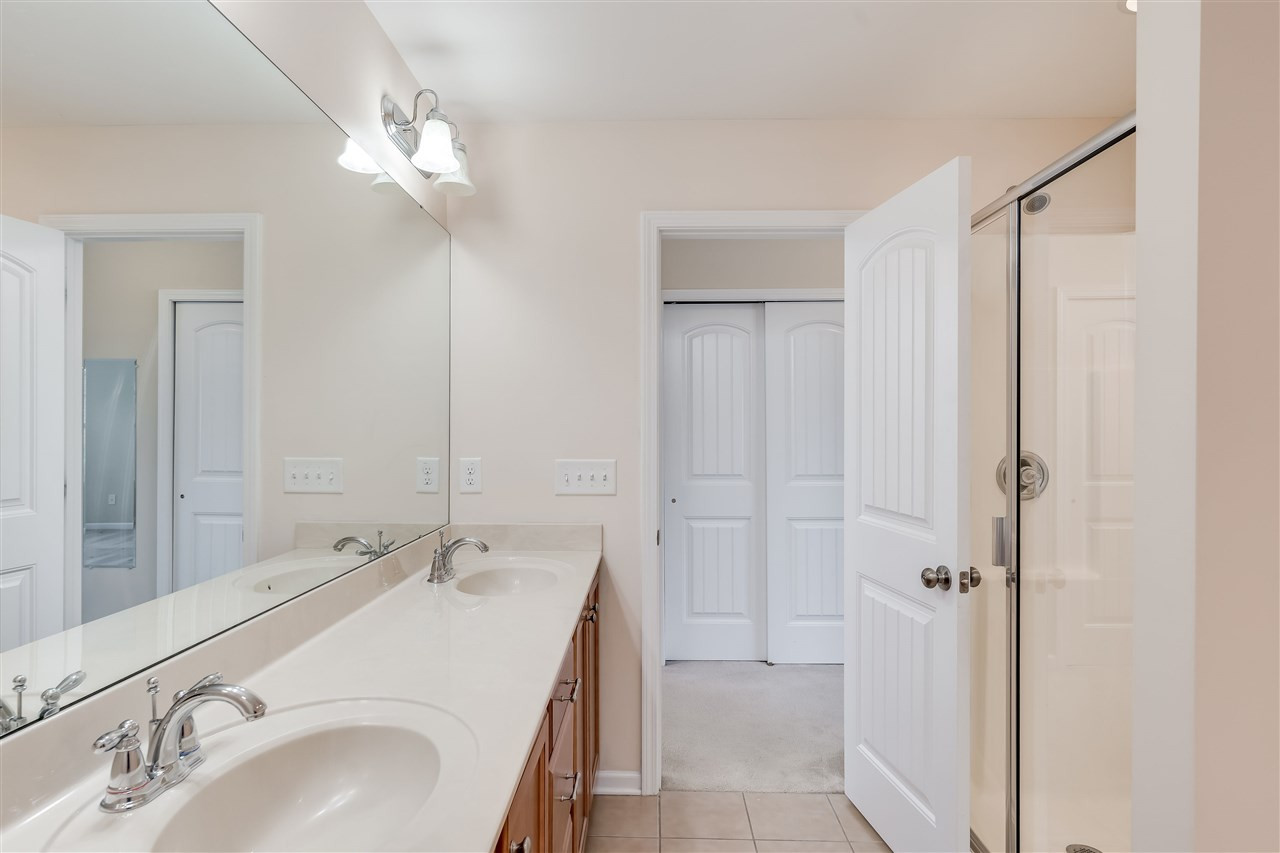 2443 Memory Ridge Drive Raleigh, NC 27606 - Photo 17 of 28 Dual vanity sinks, garden tub and separate shower, plus tile floor Owners Suite Bath