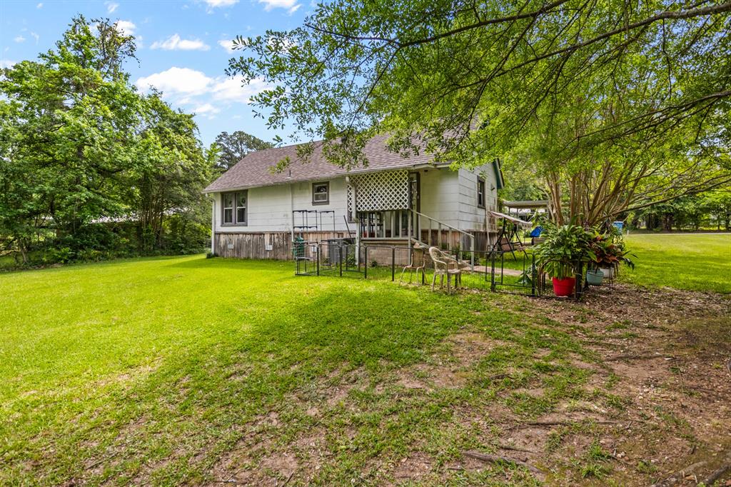 103 South Sun Camp Road White Oak, TX 75693 - Photo 39 of 40 a view of a house with a yard and sitting area