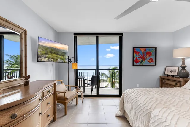 a bedroom with a bed and a flat tv screen