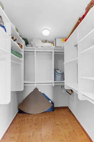 a bathroom with a toilet a sink and shower