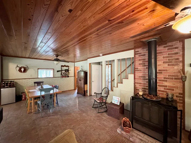 a view of a livingroom with furniture and window