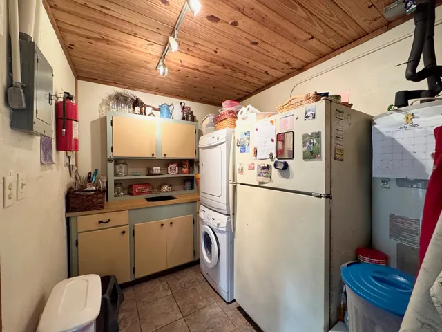 a white refrigerator freezer sitting inside of a kitchen