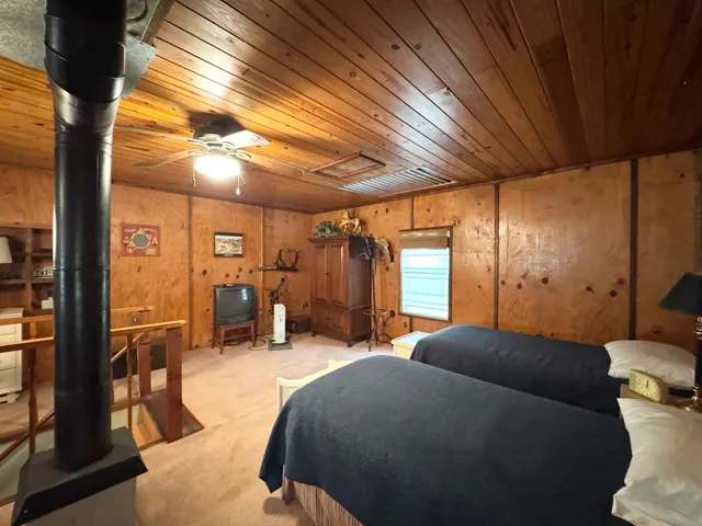 a bed room with a bed and a chandelier