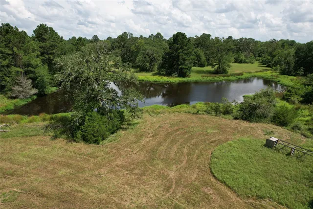 a view of a lake with houses in the back