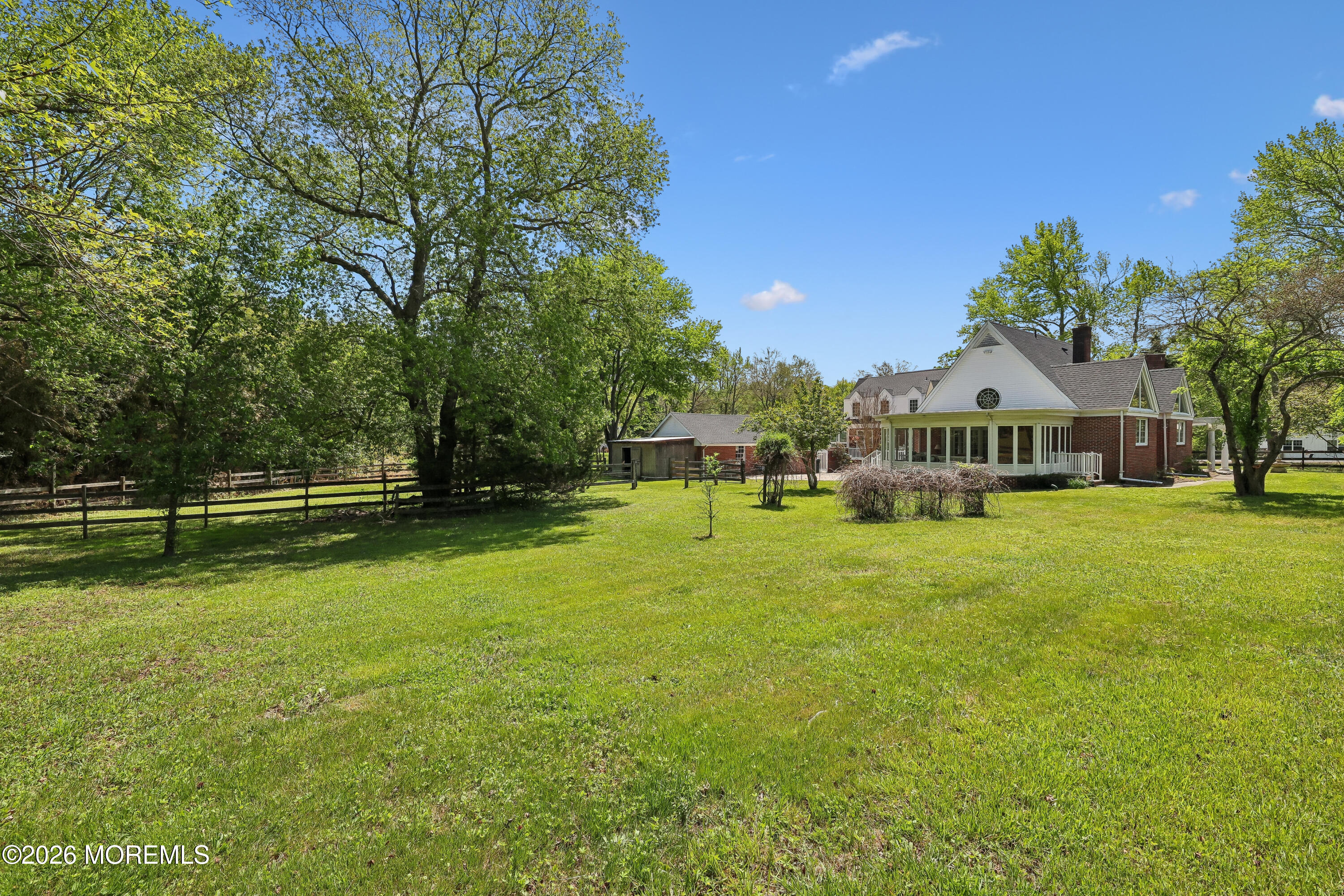 187 Hockhockson Road Colts Neck, NJ 07722 - Photo 48 of 55 a front view of a house with garden