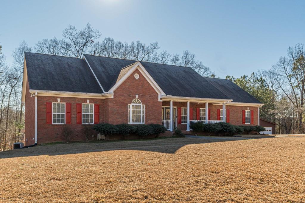 4346 Leola Road Douglasville, GA 30135 - Photo 1 of 59 a front view of house with yard and green space
