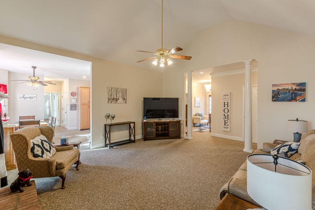4346 Leola Road Douglasville, GA 30135 - Photo 11 of 59 a living room with furniture and a flat screen tv