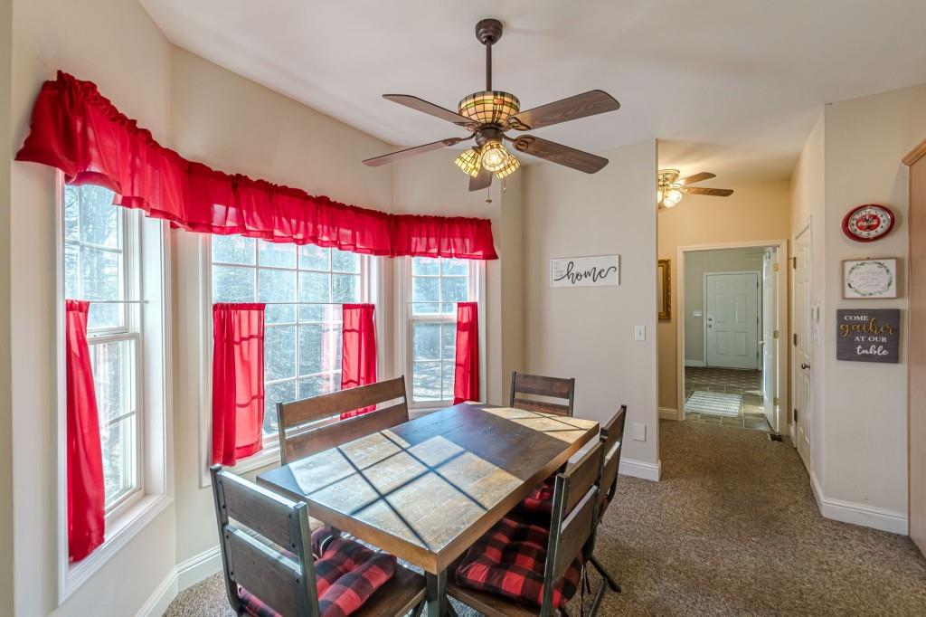 4346 Leola Road Douglasville, GA 30135 - Photo 15 of 59 a view of a dining area with furniture and a chandelier