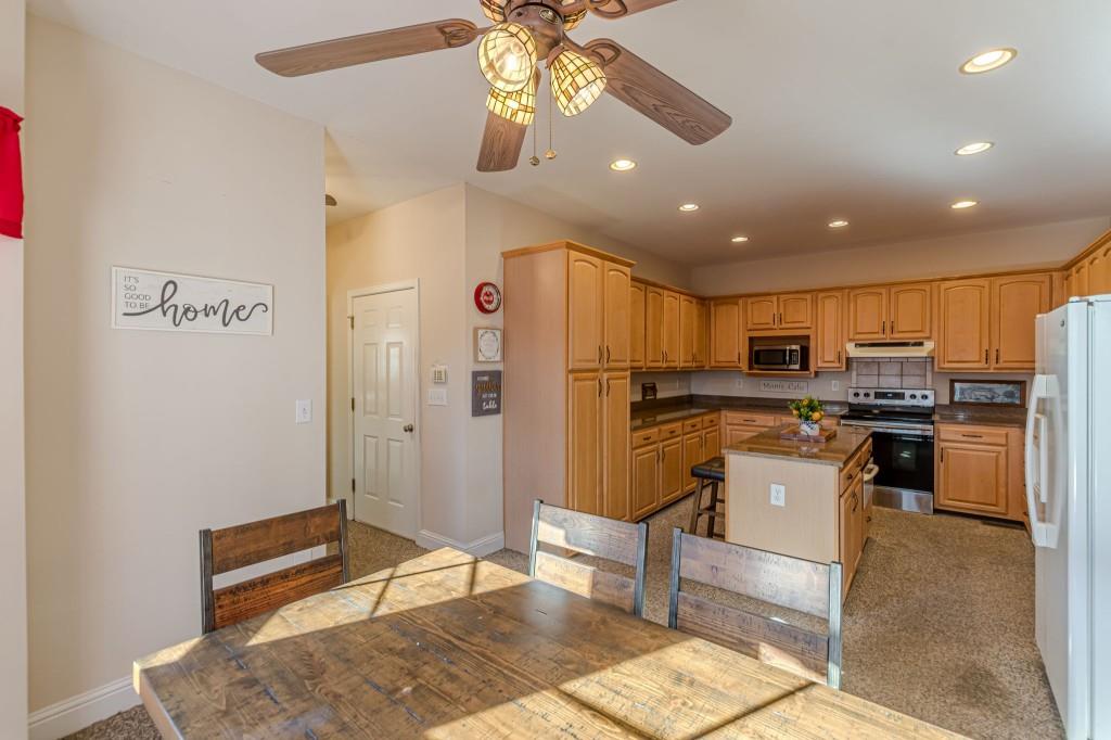 4346 Leola Road Douglasville, GA 30135 - Photo 16 of 59 a kitchen with stainless steel appliances granite countertop a refrigerator and a stove top oven